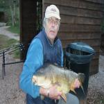   Jim Pike with a 28lb  5oz Common Carp taken at Mirror Lake Newbarn Farm